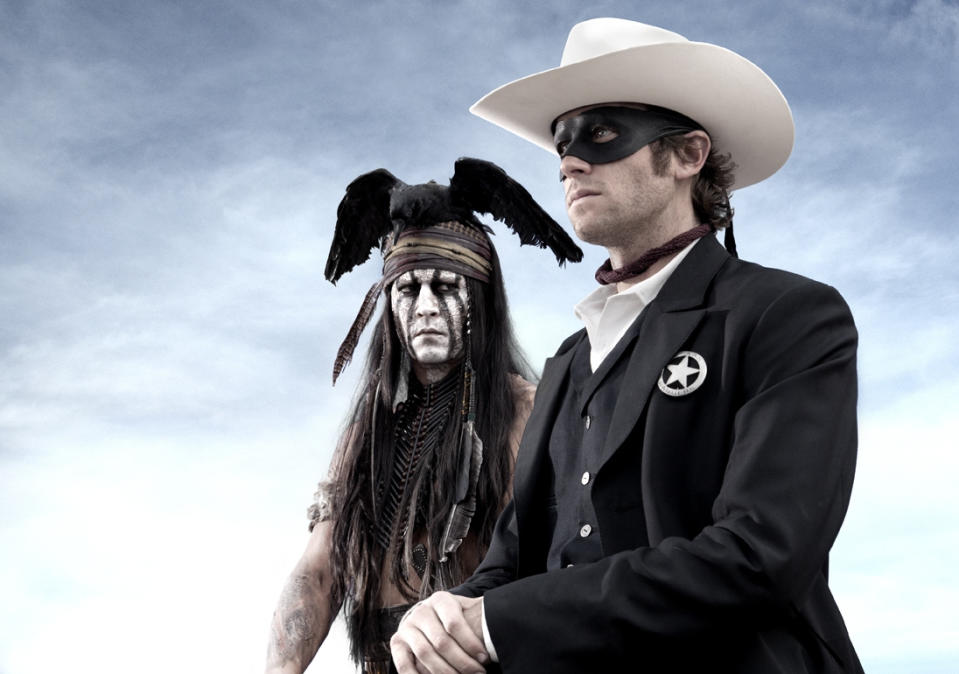 FILE - An undated publicity photo released by Disney/Bruckheimer Films, shows actors, Johnny Depp, left, as Tonto, a spirit warrior on a personal quest, who joins forces in a fight for justice with Armie Hammer, as John Reid, a lawman who has become a masked avenger in the film, 'The Lone Ranger." With the summer movie season now beginning in May, studios are co-opting the pop-culture convention's model of stoking interest in anticipated films by bringing sneak-peeks of new material directly to super fans. Johnny Depp and Armie Hammer took questions from fans at “The Lone Ranger” event in Las Vegas in a segment streamed live online. The film releases July 3, 2013. (AP Photo/Disney/Bruckheimer Films, Peter Mountain, File)