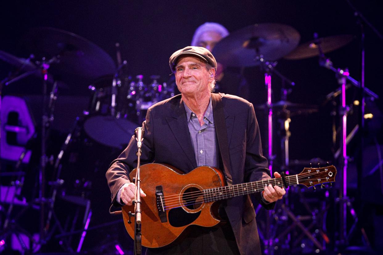 James Taylor looks out at the crowd after a song while performing at the Moody Center in Austin, Texas on July 22, 2022.