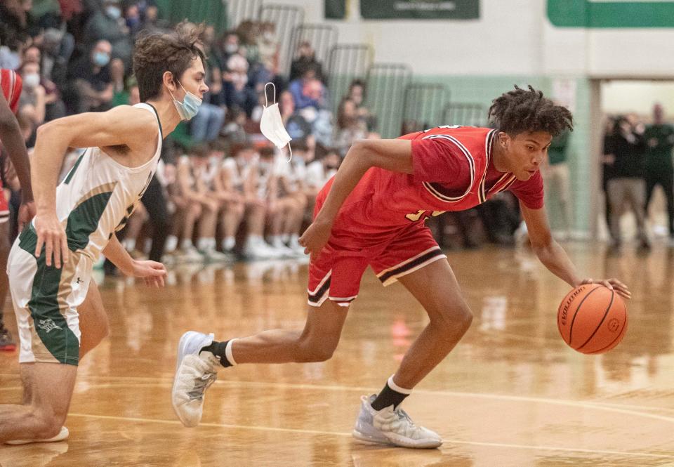 East's Matthew Hoarde drives the ball up curt against Boylan at Boylan High School on Friday, Dec. 3, 2021, in Rockford.