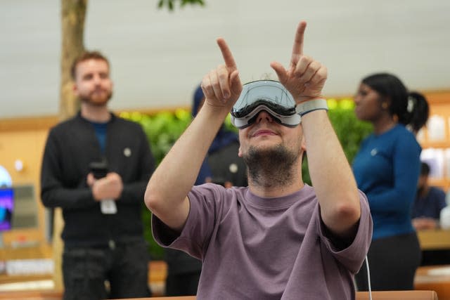 A customer tries the new Apple Vision Pro in Apple’s flagship store in Regent Street, central London