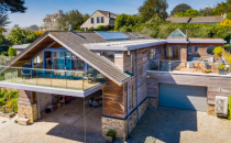 <p>Like something from Grand Designs, this spectacular award-winning home in Truro, Cornwall, has caught our eye. It might be on the market for £3.2 million, but it has contemporary <a href="https://www.housebeautiful.com/uk/decorate/a36379892/interior-tweaks-happy-home/" rel="nofollow noopener" target="_blank" data-ylk="slk:interiors;elm:context_link;itc:0;sec:content-canvas" class="link ">interiors</a>, four bedrooms, a ground floor games room, private sun terrace with a hot tub, plus direct access to the sea. </p><p><a href="https://www.zoopla.co.uk/for-sale/details/58152172/" rel="nofollow noopener" target="_blank" data-ylk="slk:This property is currently on the market for £3,250,000 with H Tiddy via Zoopla.;elm:context_link;itc:0;sec:content-canvas" class="link ">This property is currently on the market for £3,250,000 with H Tiddy via Zoopla.</a><br></p>