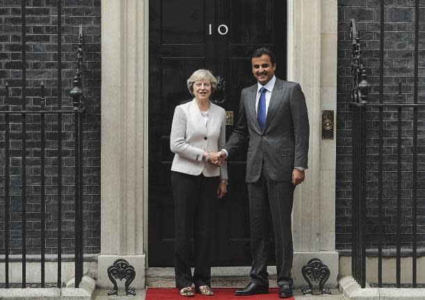 British Prime Minister Theresa May greets His Highness Sheikh Tamim bin Hamad al Thani, The Emir of Qatar (Getty Images)