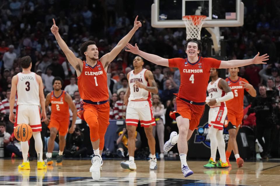 Clemson Tigers guard Chase Hunter (1) and forward Ian Schieffelin (4) celebrate after defeating the Arizona Wildcats in the semifinals of the West Regional of the 2024 NCAA Tournament at Crypto.com Arena in Los Angeles on March 28, 2024.
