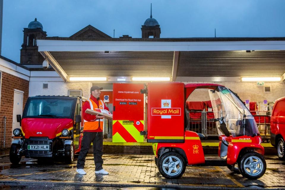 Lpading one of the micro electric vehicles at Summertown Rd, Govan, Glasgow. The first all-electric delivery office in Scotland. Oct 26 2021