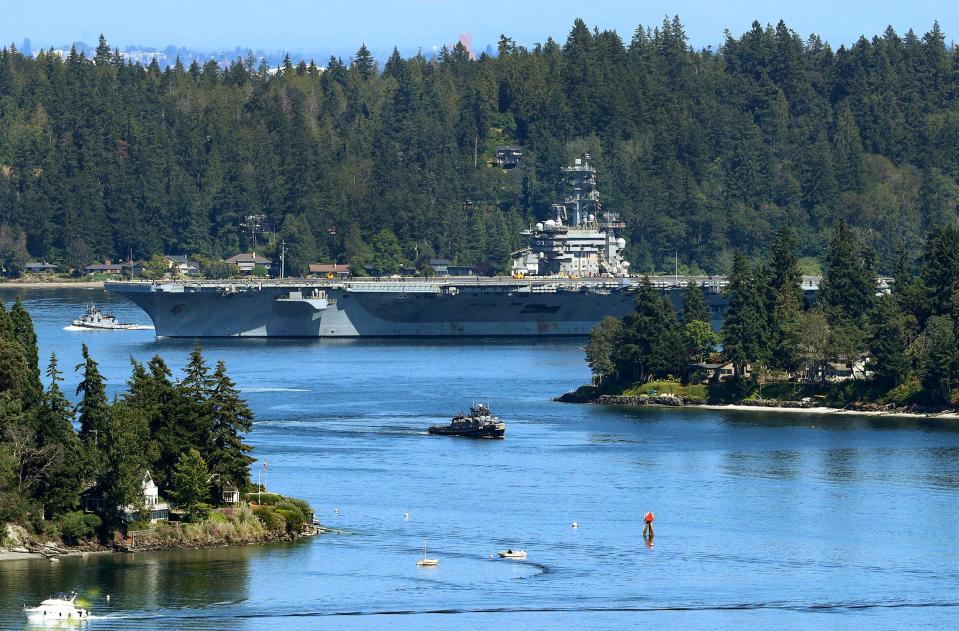 The USS Nimitz makes its way through Rich Passage as it returns to Naval Base Kitsap-Bremerton on Friday, July 22, 2022.