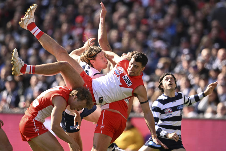 Luke Parker of the Swans is airborne during the AFL Grand Final match between the Geelong Cats and the Sydney Swans at the Melbourne Cricket Ground in Melbourne, Australia, Saturday, Sept. 24, 2022. (James Ross/AAP Image via AP)