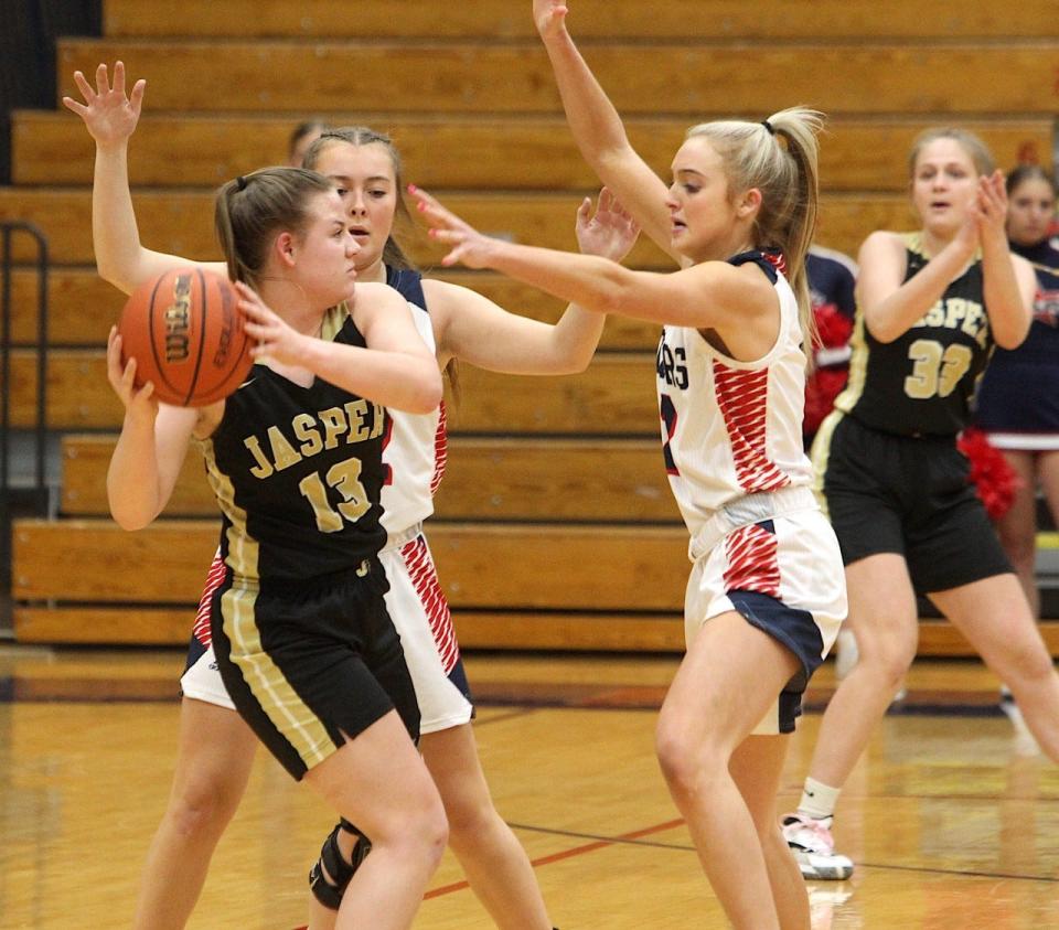 BNL's Chloe Spreen (right) and Madisyn Bailey (back) double team Jasper Aspen Sermersheim Saturday afternoon in the Lady Stars' 60-31 victory.