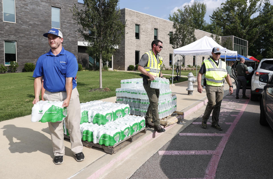 The City of Germantown handed out bottled water to residents on Monday, July 24, 2023 at Forest Hill Elementary School in Germantown, Tenn. Residents of the Tennessee city were told that diesel fuel spilled into a local reservoir, and to avoid drinking tap water. People remain under an order Wednesday, July 26 to avoid using water for everything except flushing toilets. They can’t drink or boil tap water, or use it showering or bathing. (Mark Weber/Daily Memphian via AP)