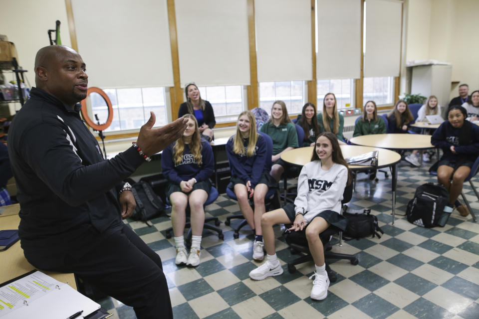 FILE - Troy Vincent, NFL Executive Vice President of Football Operations, left, talks with students at Mount St. Mary Academy on Wednesday, Jan. 18, 2023, in Kenmore, N.Y. (AP Photo/Joshua Bessex, File)