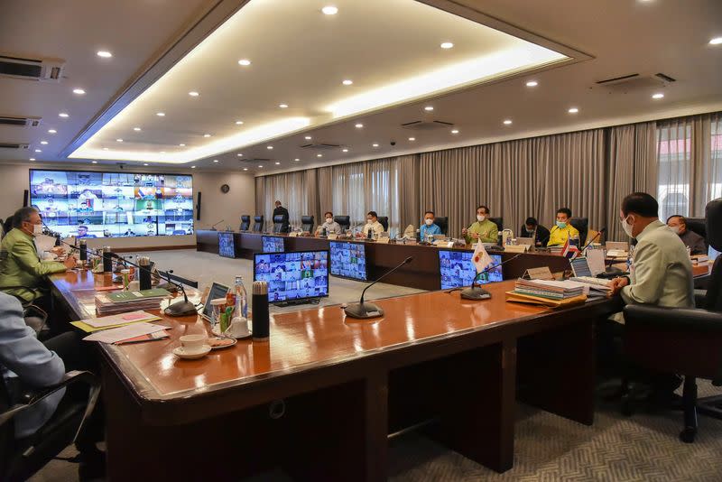 Thailand's Prime Minister Prayuth Chan-ocha wears a protective face mask due to the coronavirus disease (COVID-19) outbreak during a teleconference for a weekly cabinet meeting with his ministers at the Government House in Bangkok