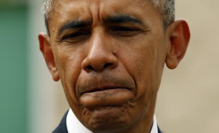 U.S. President Barack Obama pauses while speaking immediately after meeting with families of victims of the shooting rampage in Roseburg, Oregon October 9, 2015. REUTERS/Kevin Lamarque