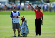 ORLANDO, FL - MARCH 25: Tiger Woods of the USA waits to play his second shot at the par 4, first hole with his caddie Joe LaCava of the USA during the final round of the 2012 Arnold Palmer Invitational presented by MasterCard at Bay Hill Club and Lodge on March 25, 2012 in Orlando, Florida. (Photo by David Cannon/Getty Images)