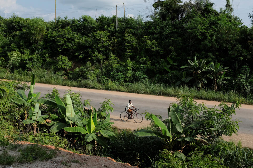 A boy rides along a road in Denyase, Ashanti region, Ghana. (Photo: Francis Kokoroko/Reuters)