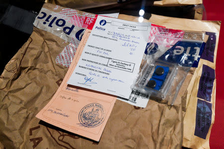 Documents presented as evidence are displayed during the trial of Mehdi Nemmouche and Nacer Bendrer, who are suspected of killing four people in a shooting at Brussels' Jewish Museum in 2014, at Brussels' Palace of Justice, Belgium January 15, 2019. Frederic Sierakowski/Pool via REUTERS