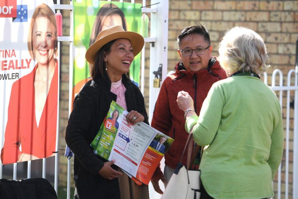 Independent candidate Dai Le handing out how-to-vote cards in Fowler on Thursday.