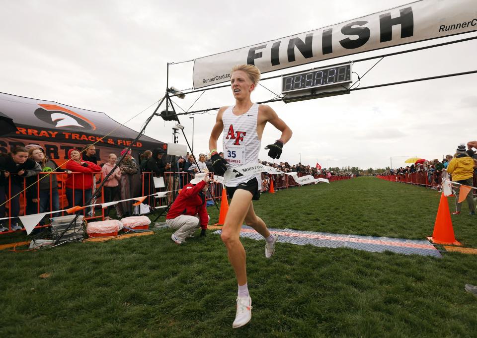 American Fork’s Daniel Simmons takes the tape as 6A runners compete in the state high school cross-country championships.