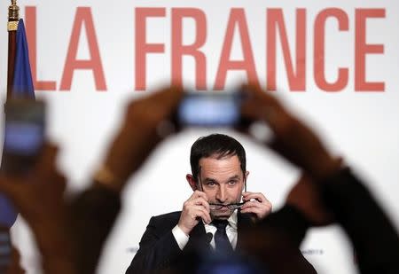 Former French education minister Benoit Hamon reacts after partial results in the second round of the French left's presidential primary election in Paris, France, January 29, 2017. REUTERS/Christian Hartmann