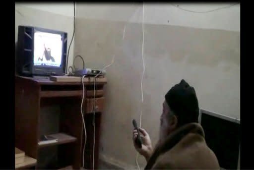 A still from a US Department of Defense(DoD) video shows former Al Qaeda leader Osama bin Laden watching himself on television. The death of their figurehead and US drone attacks in the Pakistani highlands have disrupted Al-Qaeda's core guerrilla organisation, now reduced to a few dozen militants battling for their own survival, experts say