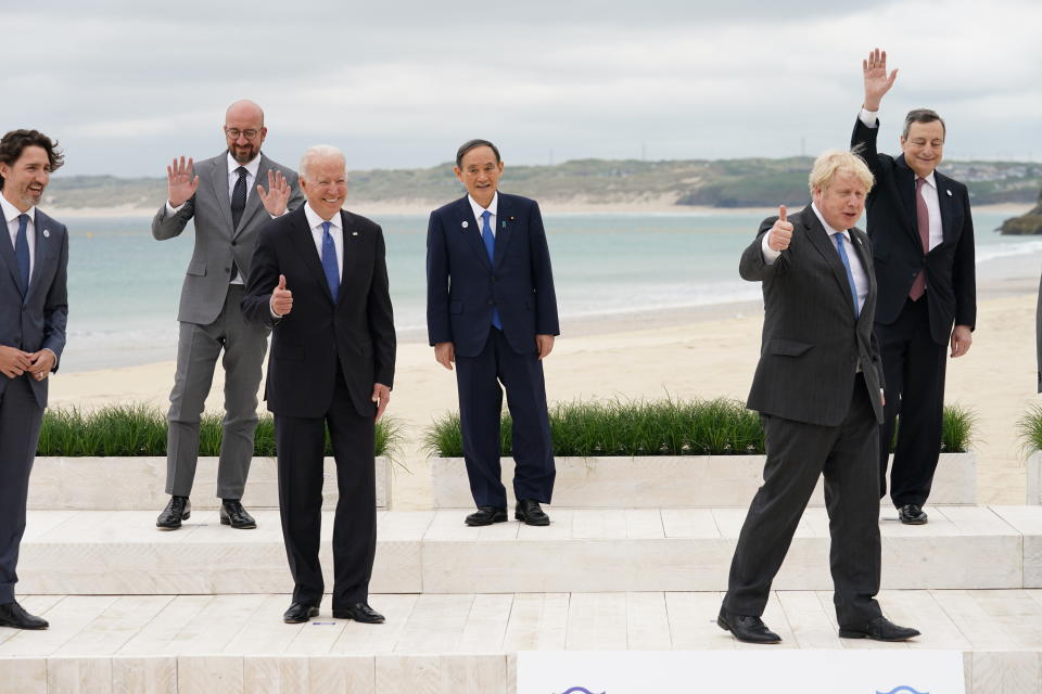 From left, Canadian Prime Minister Justin Trudeau, European Council President Charles Michel, U.S. President Joe Biden, Japan's Prime Minister Yoshihide Suga, British Prime Minister Boris Johnson and Italy's Prime Minister Mario Draghi pose for a family photo during the G7 summit in Carbis Bay, England, Friday,  June 11, 2021. (Kevin Lamarque/Pool via AP)