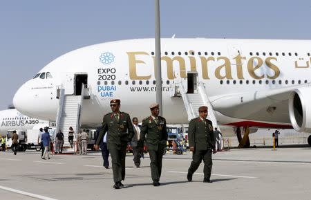 UAE officers walk in front of Emirates Airbus A380 plane at the Dubai Airshow November 8, 2015. REUTERS/Ahmed Jadallah