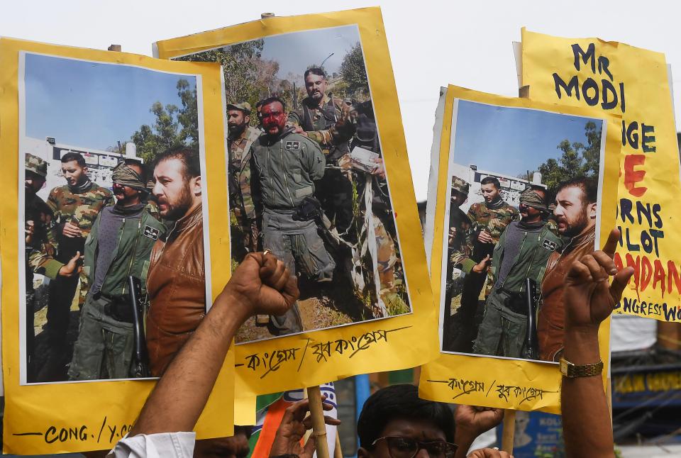 Congress activists shout slogans against Pakistan as they hold posters and pictures of captive Indian Air Force pilot Abhinandan Varthaman, demanding his speedy release in Kolkata on February 28, 2019. (DIBYANGSHU SARKAR/AFP via Getty Images)