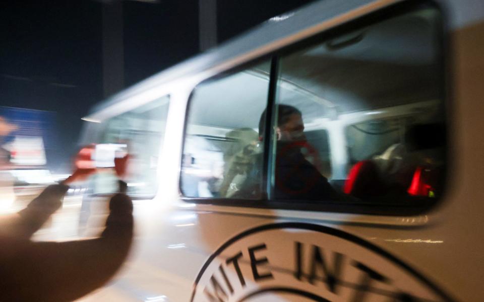 A Red Cross vehicle arrives at Egypt's Rafah crossing as part of a convoy carrying freed hostages