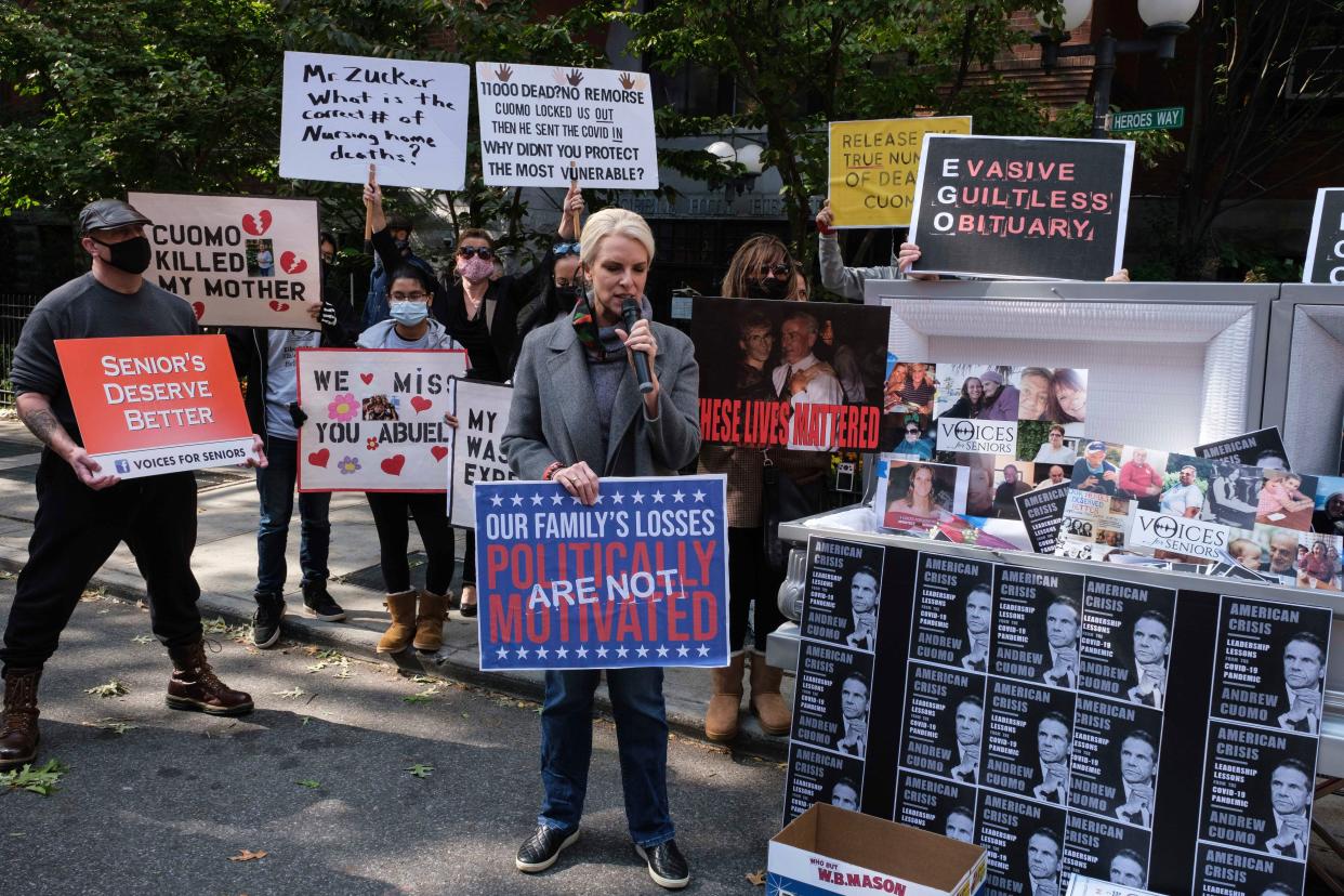 Families of COVID-19 victims who passed away in New York nursing homes gather in front of the Cobble Hill Health Center to demand New York State Gov. Andrew Cuomo apologize for his response to clusters in nursing homes during the pandemic in Brooklyn, New York.