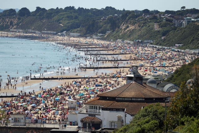 People crowd on the beach in Bournemouth, Dorset, in June 