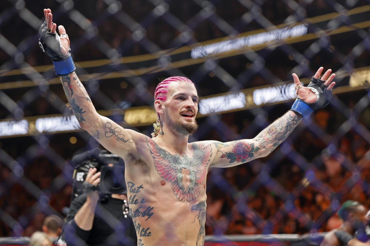 Sean O'Malley celebrates after defeating Aljamain Sterling for the bantamweight title at UFC 292 on Saturday in Boston. (AP Photo/Gregory Payan)