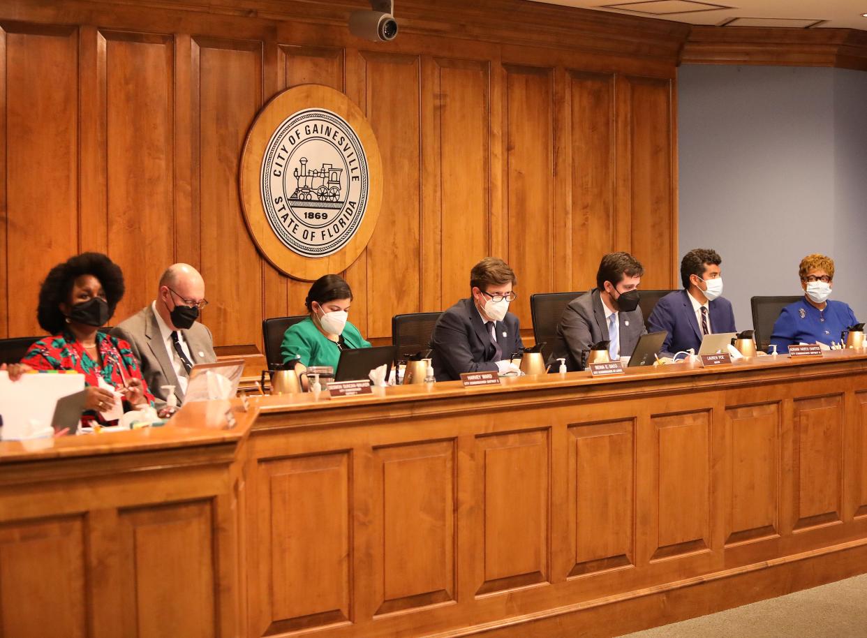 The Gainesville City Commission, from left to right, Desmon Duncan-Walker, Harvey Ward, Reina Saco, Mayor Lauren Poe, Adrian Hayes-Santos, David Arreola and Cynthia Chestnut, meets for the first time with new Commissioner Cynthia Chestnut at City Hall in Gainesville, Feb. 17, 2022.