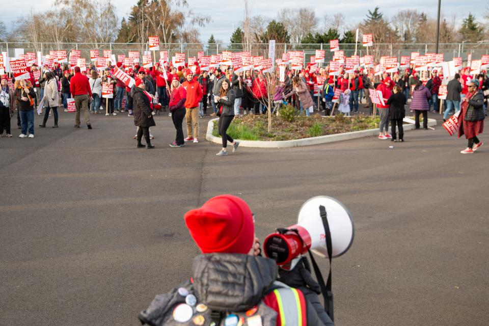 Kelsey Dunlap, chair of Salem Keizer Education Association, leads a practice picket in the McKay High School parking lot Wednesday.