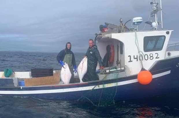 Marc Russell and a second crew member aboard the Island Lady. The pair was last heard from around 4:00 p.m. on Friday. (Submitted/Dwight Russell  - image credit)