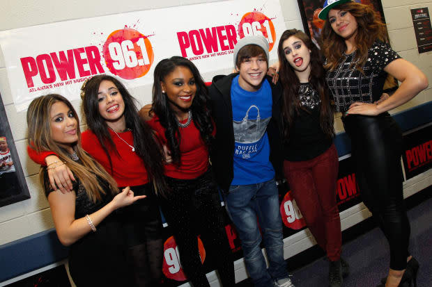 Ally Brooke, Camila Cabello, Normani Kordei, Lauren Jauregui, and Dinah Jane Hansen of Fifth Harmony pose with Austin Mahone (third from right) backstage at Power 96.1's Jingle Ball 2013 at Philips Arena on Dec. 11, 2013, in Atlanta.<p><a href="https://www.gettyimages.com/detail/455211293" rel="nofollow noopener" target="_blank" data-ylk="slk:Ben Rose/Getty Images" class="link ">Ben Rose/Getty Images</a></p>