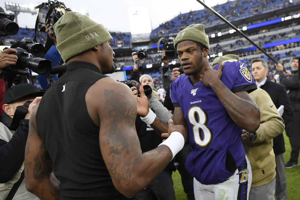 Houston Texans quarterback Deshaun Watson, left, shakes hands with Baltimore Ravens quarterback Lamar Jackson after an NFL football game, Sunday, Nov. 17, 2019, in Baltimore. The Ravens won 41-7. (AP Photo/Nick Wass)