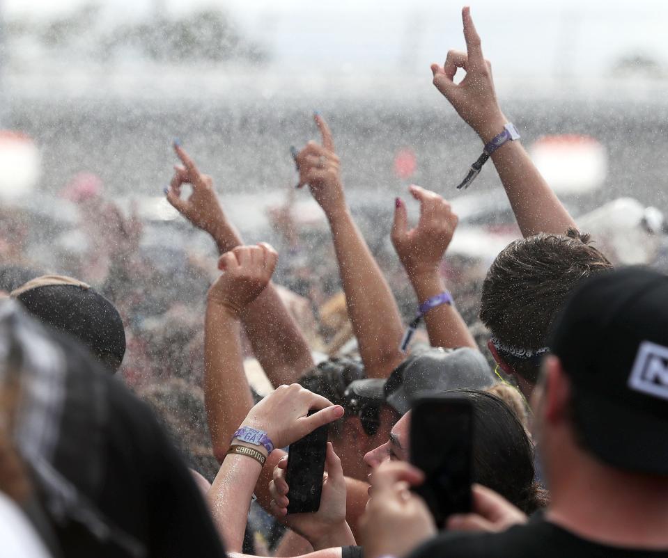 Fans get sprayed with a fire hose in front of the Octane stage at the 2022 edition of Welcome to Rockville in Daytona Beach. The four-day heavy-metal music fest returns on May 18-21 to Daytona International Speedway.