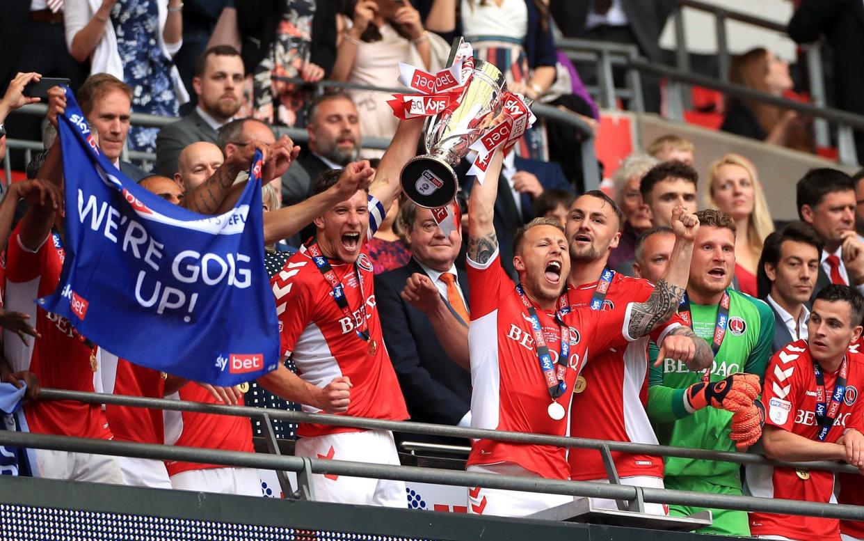 Charlton lift the League One play-off trophy after Patrick Bauer's dramatic late winner gives Sunderland no time to reply - PA