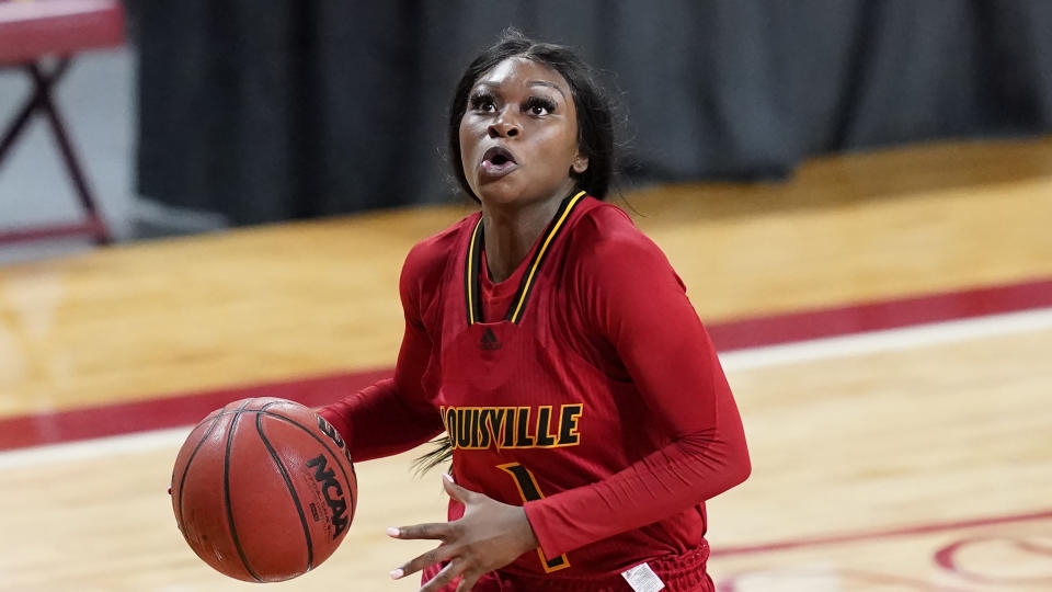 Dana Evans eyes the basket with ball in hand. 