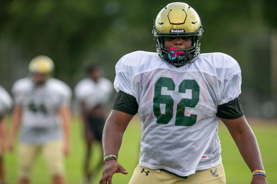 Tommy Kinsler works during preseason drills at Trinity Catholic in Ocala.