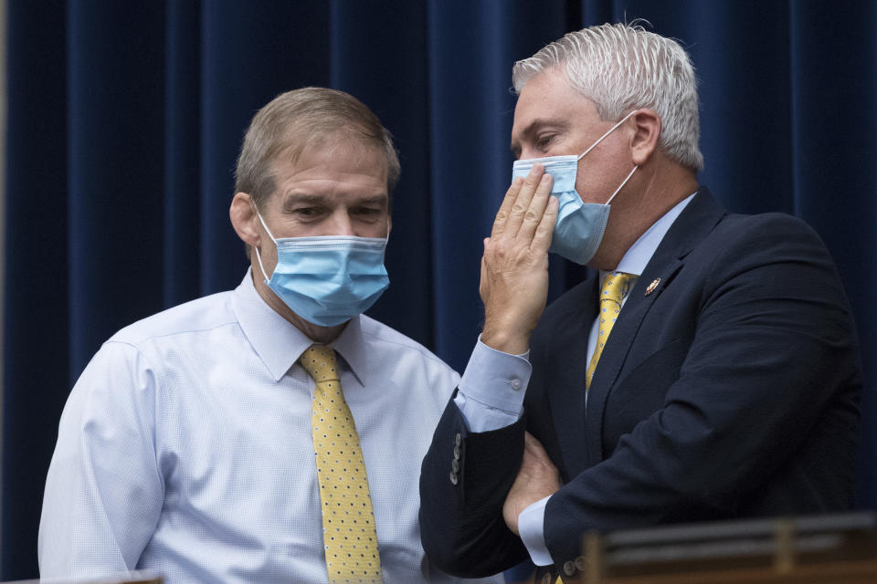 Ranking Member Rep. James Comer, R-Ky., right, speaks with Rep. Jim Jordan, R-Ohio, left, during a House Committee on Oversight and Reform hearing on the 2020 Census​ on Capitol Hill, Wednesday, July 29, 2020, in Washington. (AP Photo/Andrew Harnik)