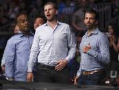 Donald Trump Jr., right, poses for a photo with Eric Trump at UFC Fight Night Saturday, Aug. 3, 2019, in Newark, N.J. Guida stopped Miller in the first round. (AP Photo/Frank Franklin II)