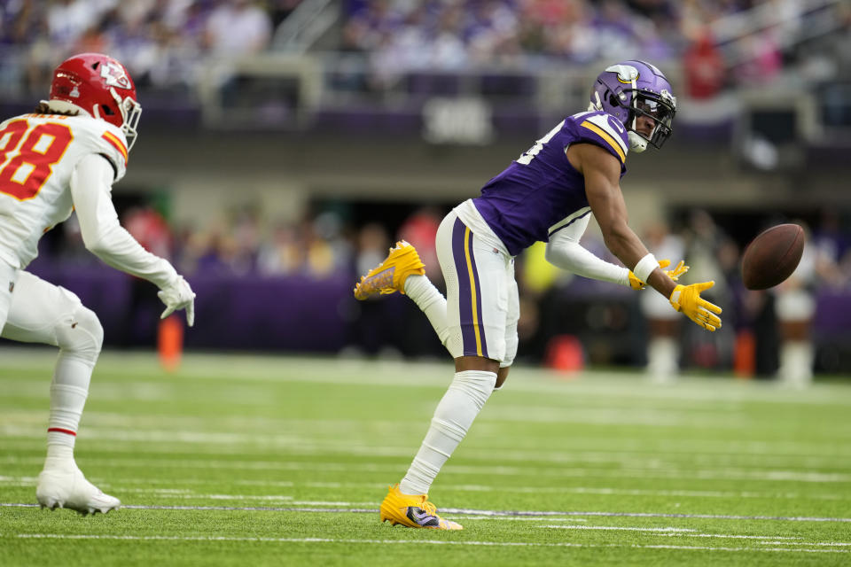 Minnesota Vikings wide receiver Justin Jefferson looks to catch a pass in front of Kansas City Chiefs cornerback L'Jarius Sneed, left, during the first half of an NFL football game, Sunday, Oct. 8, 2023, in Minneapolis. The pass was incomplete. (AP Photo/Abbie Parr)