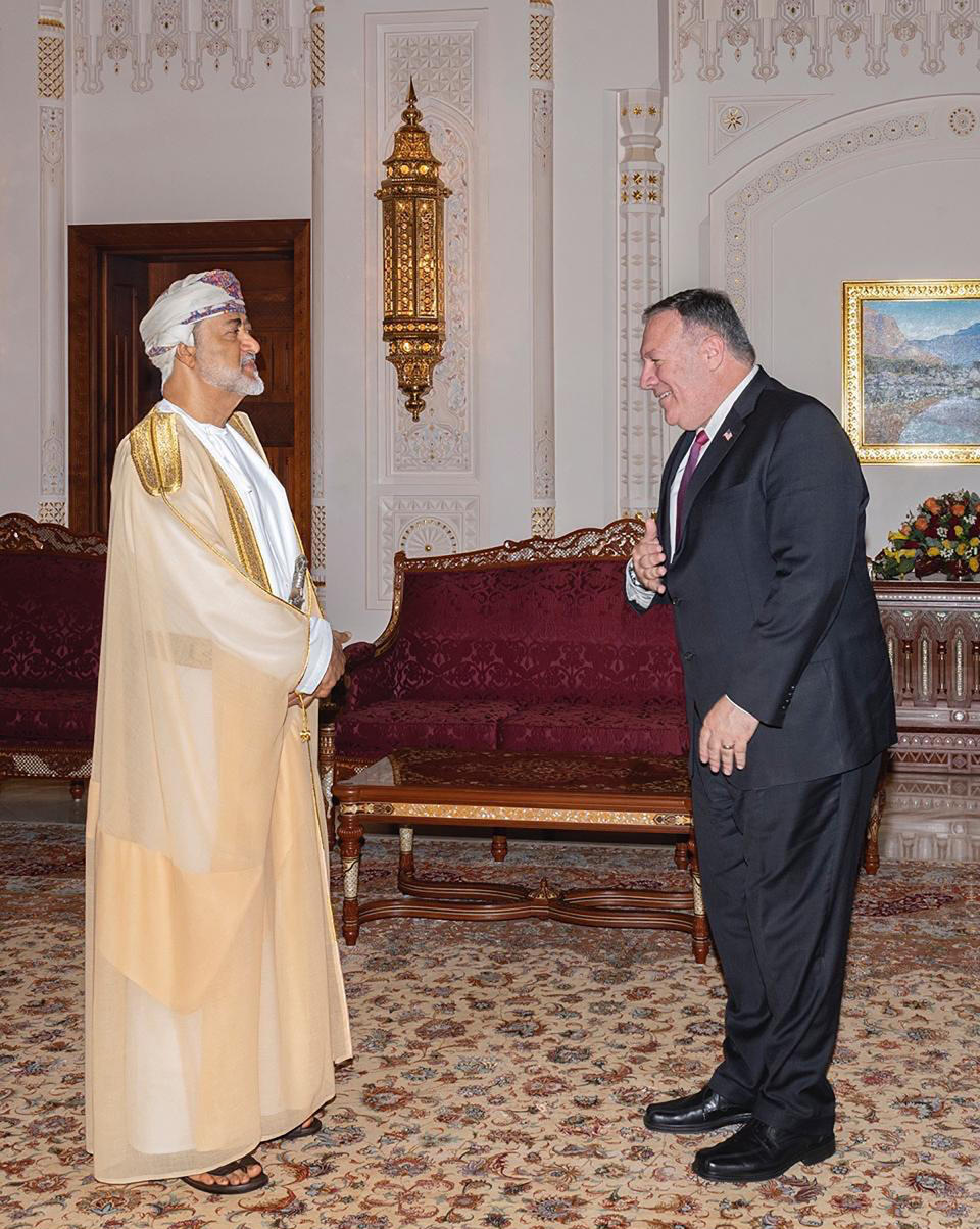 In this photo released by the state-run Oman News Agency, U.S. Secretary of State Mike Pompeo, right, meets with Oman's Sultan Haitham bin Tariq in Muscat, Oman, Thursday, Aug. 27, 2020. Pompeo visited Oman's new sultan on Thursday, the last stop on a Mideast trip that sought to build on an American-brokered deal to have Israel and the United Arab Emirates normalize relations. (Oman News Agency via AP)