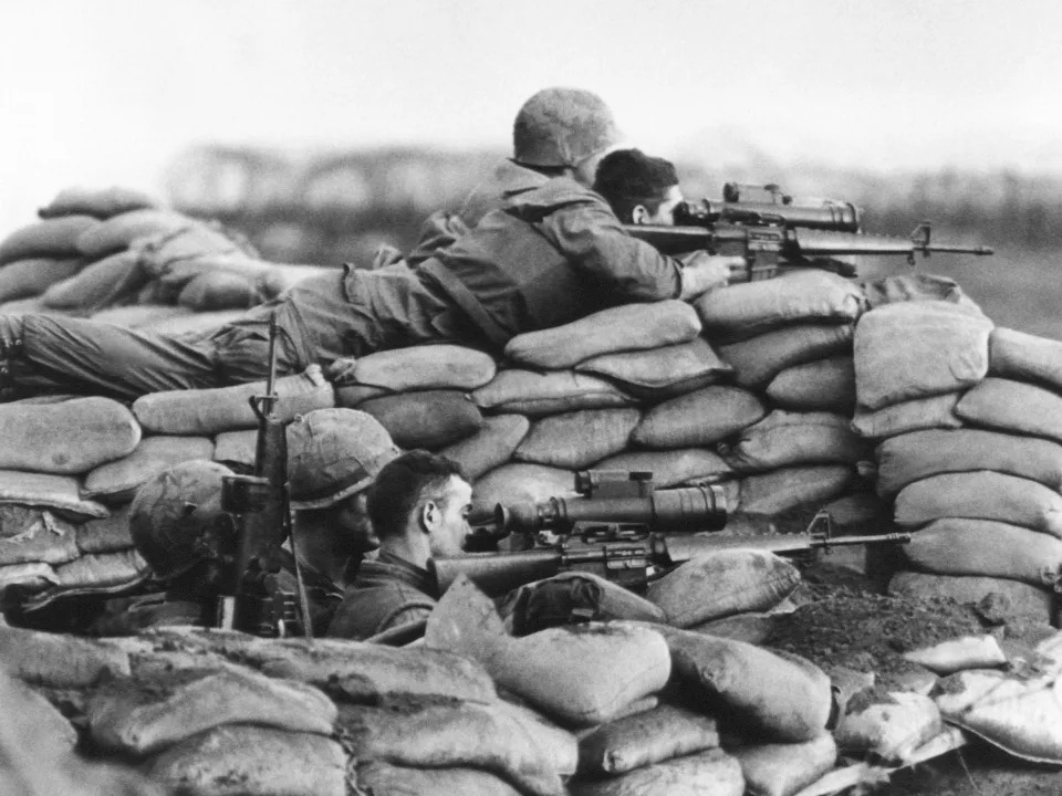 US Marines in Vietnam use their M16 rifles in 1968.
