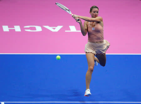 Tennis - Pan Pacific Open Women's Singles Semifinal match - Arena Tachikawa Tachihi, Tokyo, Japan - September 22, 2018. Camila Giorgi of Italy returns a ball to Naomi Osaka of Japan. REUTERS/Toru Hanai