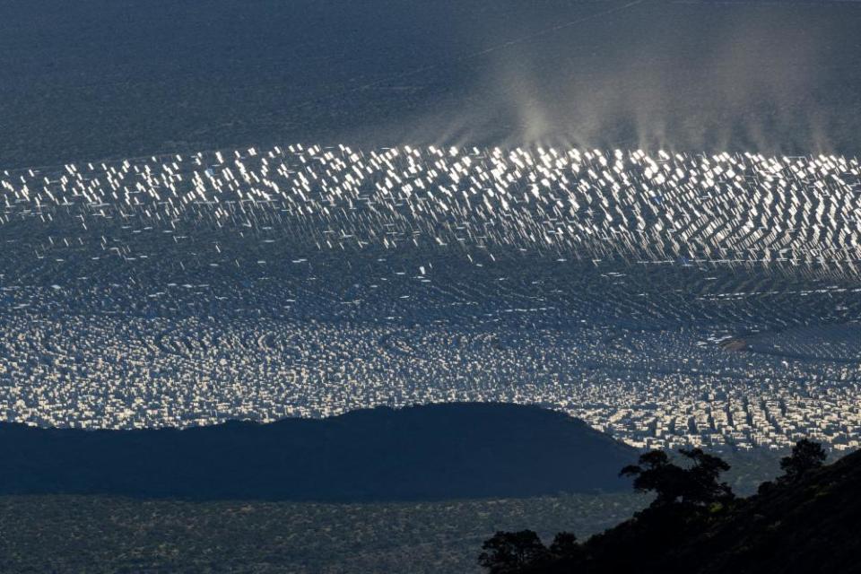 Mirrors sprawl across the desert at the Ivanpah solar electric generating system near Nipton, California.