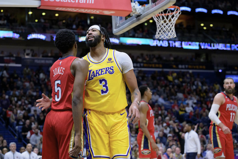 Los Angeles Lakers forward Anthony Davis (3) congratulates New Orleans Pelicans forward Herbert Jones (5) after Jones intentionally fouled and blocked him from scoring a slam dunk in the first half of an NBA basketball game in New Orleans, Tuesday, March 14, 2023. (AP Photo/Matthew Hinton)