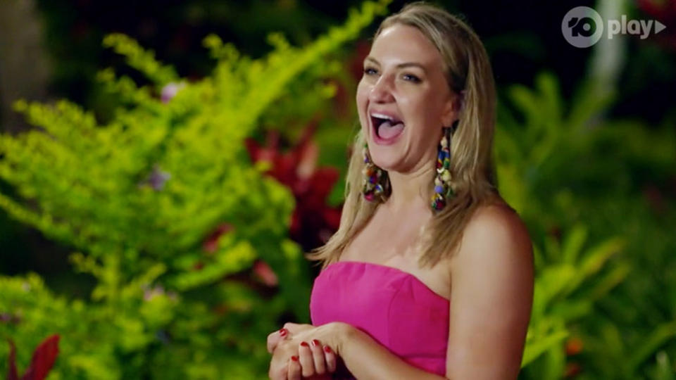 Alisha Aitken-Radburn wearing a pink strapless dress and red nail polish on Bachelor In Paradise Australia 2020.