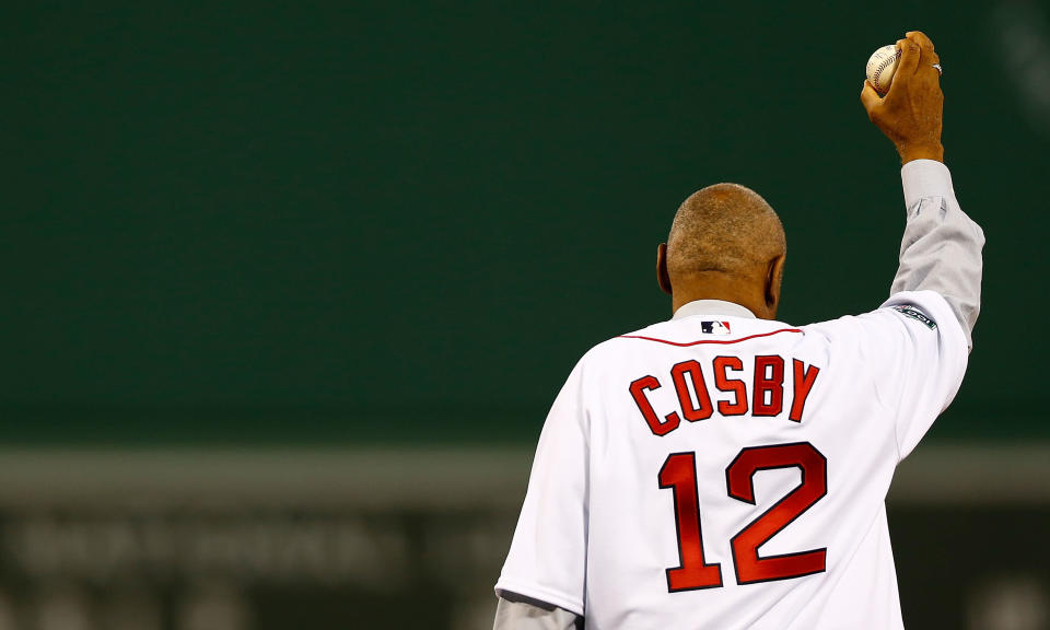 BOSTON, MA - SEPTEMBER 13:  Actor Bill Cosby gestures to the crowd before throwing out the first pitch prior to the game between the Boston Red Sox and the New York Yankees on September 13, 2012 at Fenway Park in Boston, Massachusetts.  (Photo by Jared Wickerham/Getty Images)