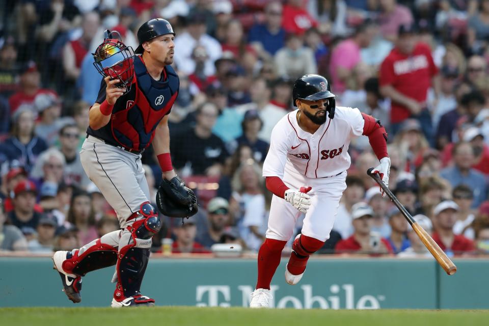 Boston Red Sox's Jack Lopez, right, runs on his sacrifice bunt in front of Cleveland Indians' Ryan Lavarnway during the seventh inning of a baseball game, Saturday, Sept. 4, 2021, in Boston. (AP Photo/Michael Dwyer)