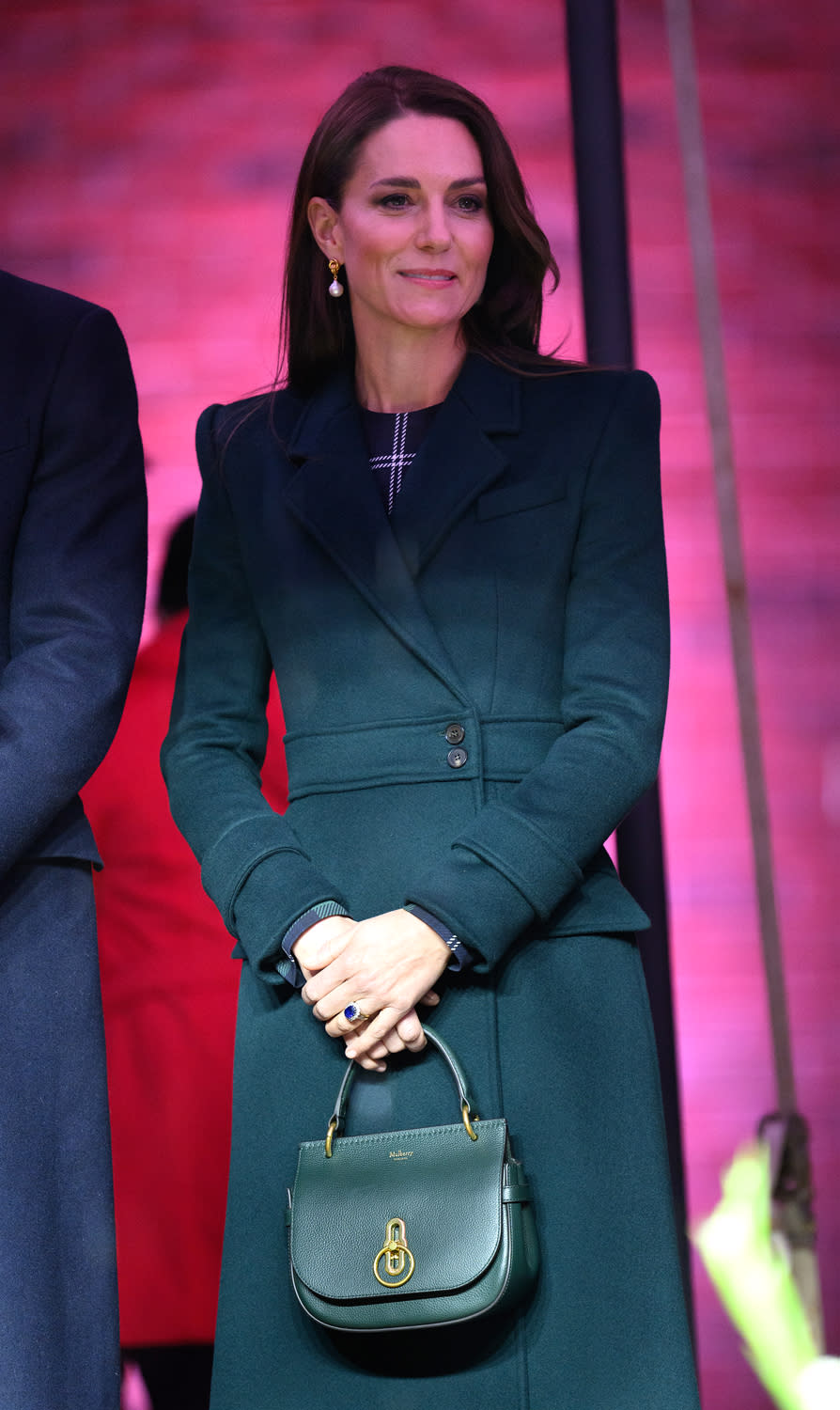 <p>For their <a href="https://people.com/royals/kate-middleton-prince-william-arrive-boston-welcome-mayor-michelle-wu/" rel="nofollow noopener" target="_blank" data-ylk="slk:first public appearance;elm:context_link;itc:0;sec:content-canvas" class="link ">first public appearance</a> of the Boston tour outside Boston City Hall, Princess Kate added a green coat by Alexander McQueen over her dress and carried the Mulberry Amberley Small Satchel. </p>